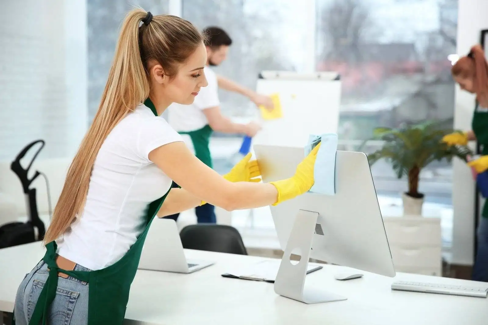Our cleaner wiping a monitor